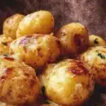 Delmonico Potatoes recipe with creamy cheese and herbs baked to perfection.