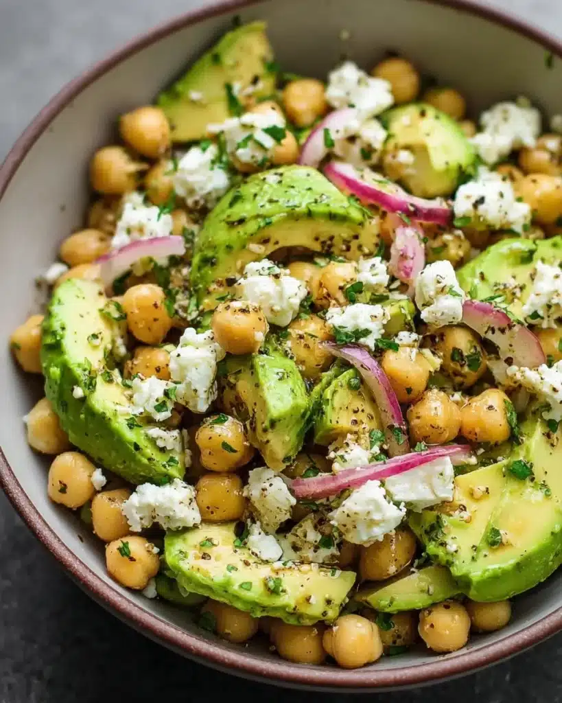 Chickpea Feta Avocado Salad with fresh ingredients in a bowl