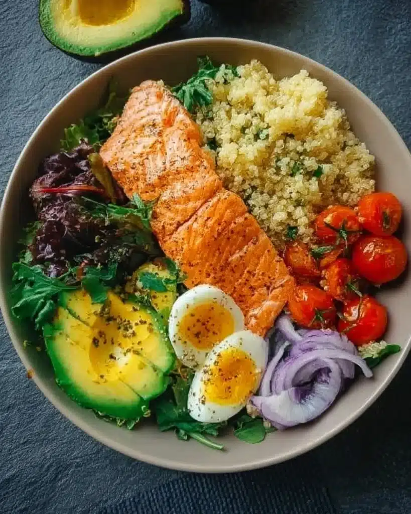 Healthy quick salmon protein bowl with vegetables and grains