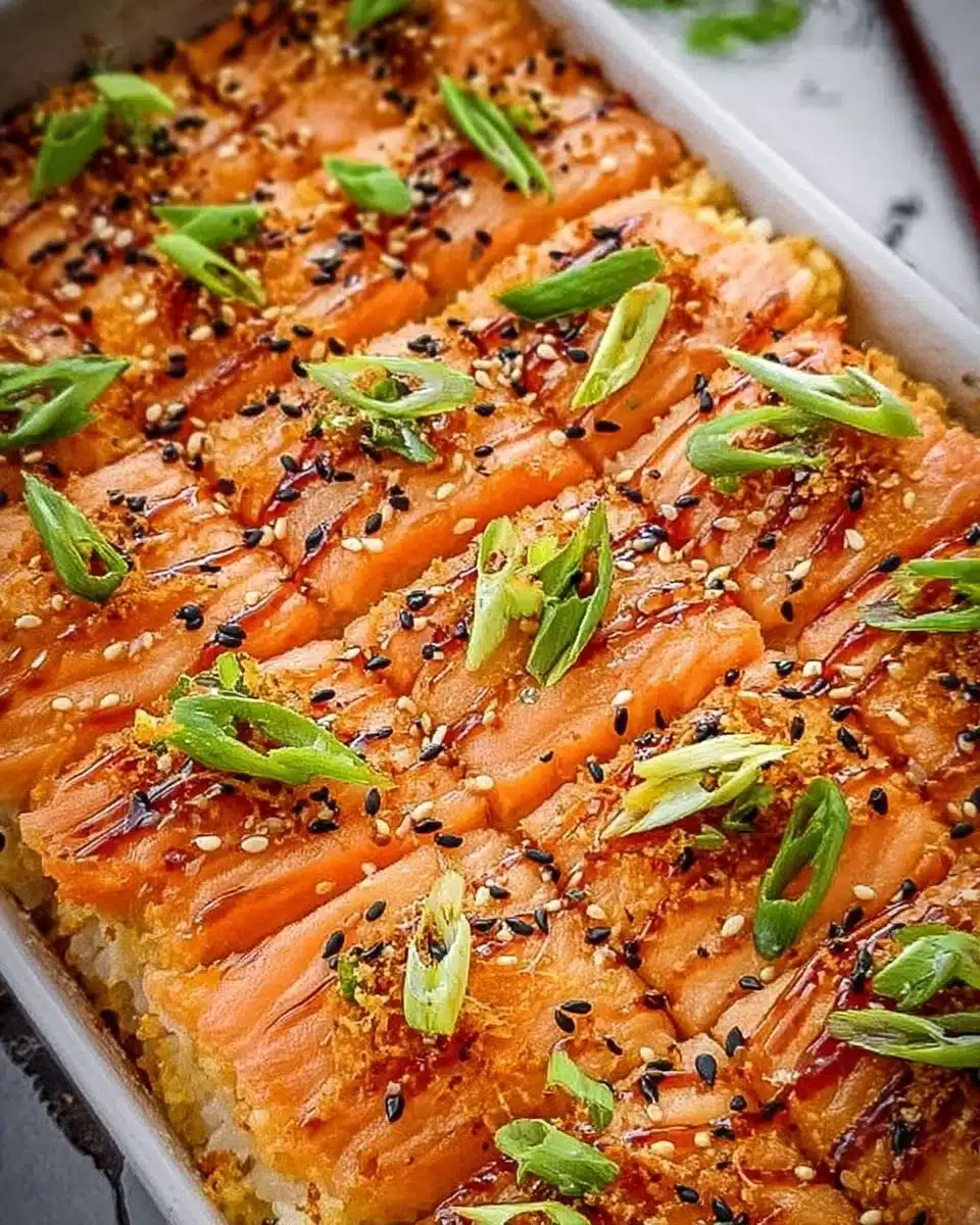 Delicious salmon sushi bake with layers of salmon and rice in a baking dish