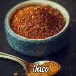 Homemade taco seasoning blend in a small bowl with spices.