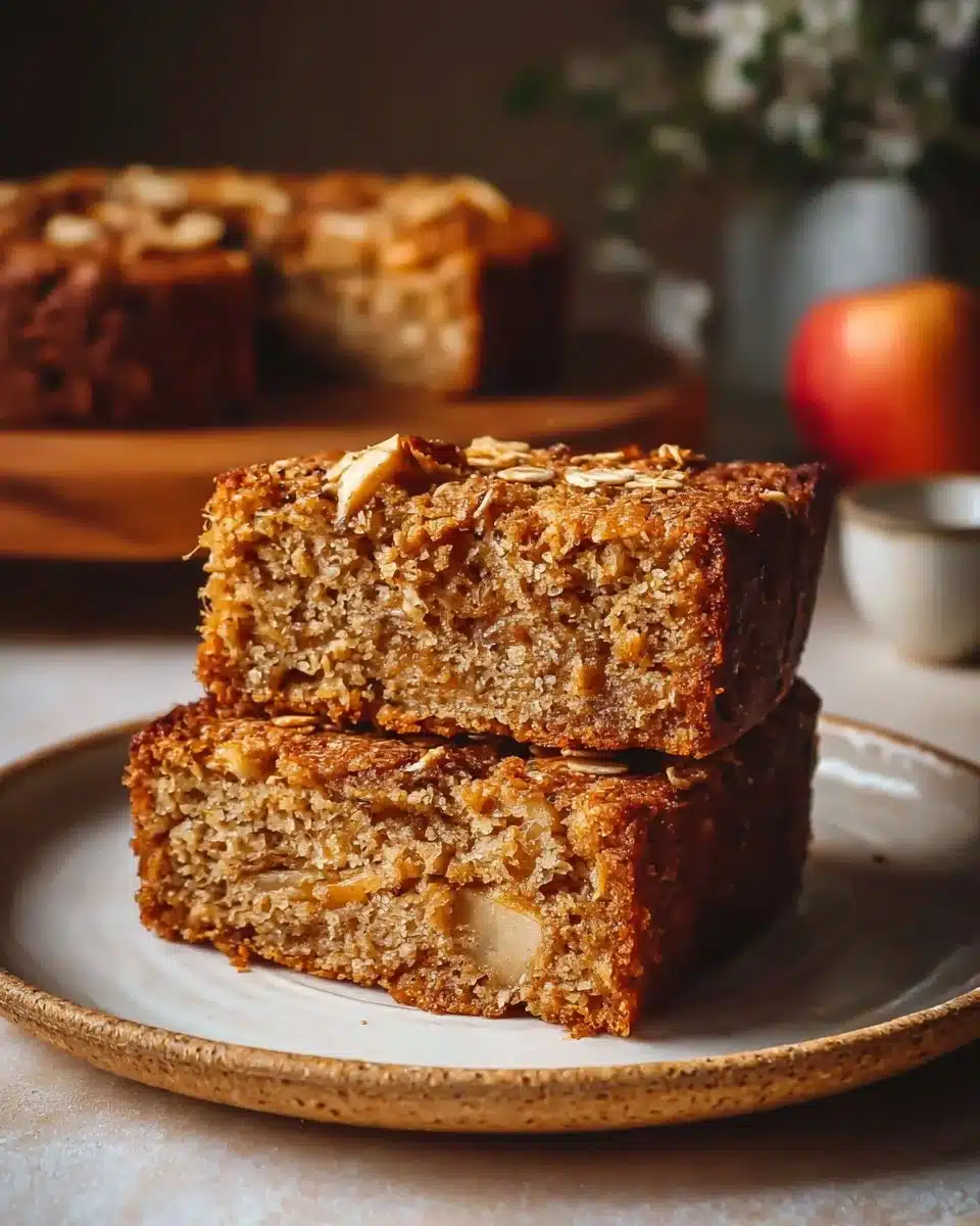 Delicious oatmeal apple cake topped with fresh apple slices