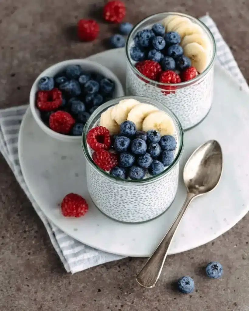 Creamy vanilla chia pudding topped with fresh fruits and nuts