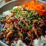 Delicious slow cooker Asian pulled pork served with fresh vegetables
