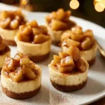 Delicious Apple Crisp Mini Cheesecakes topped with spiced apples and crisp crumble.