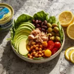 Crispy chickpea tuna salad served in a bowl with fresh vegetables