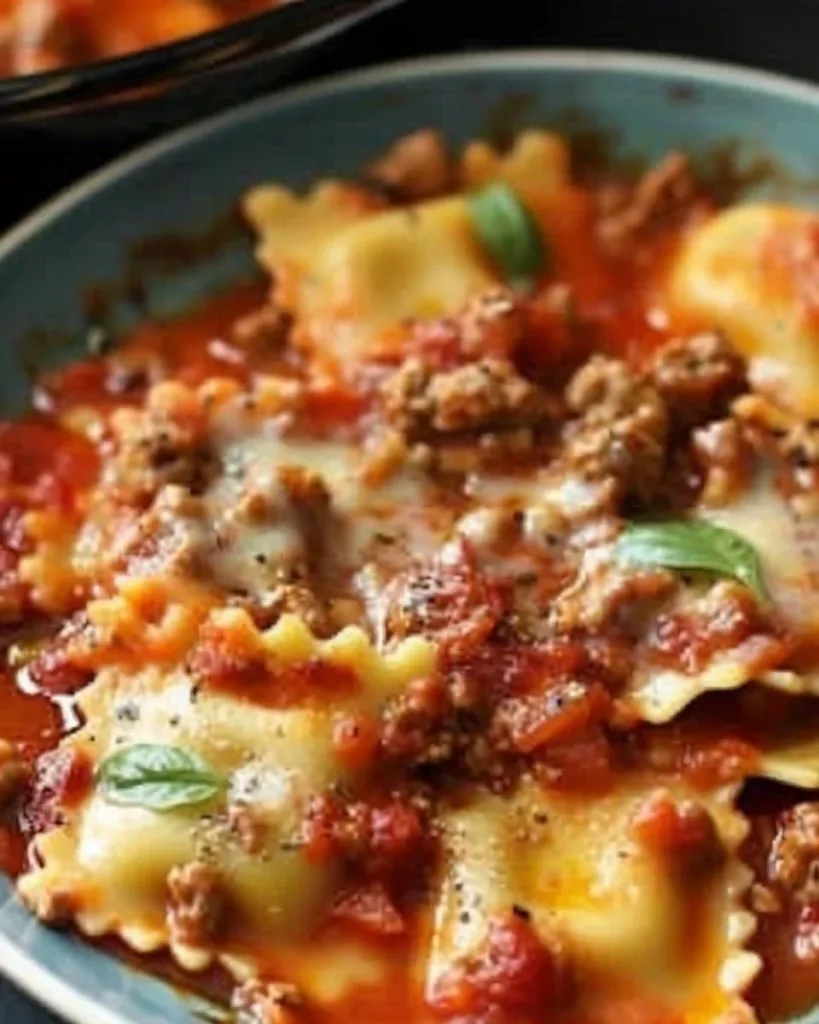 Crockpot Ravioli Lasagna with layers of cheese and marinara sauce