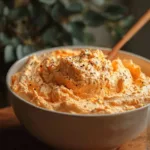 Easy Cottage Cheese Buffalo Chicken Dip garnished with fresh herbs