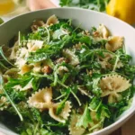 Delicious Lemon Arugula Pasta Salad with fresh greens and lemon dressing.